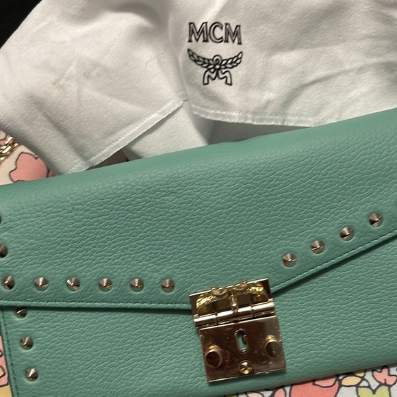 Small MCM wallet purse Teal colored . Comes with box and bag
